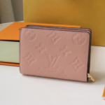 Louis Vuitton's Signature Monogram Motif Cléa Wallet - Pink