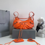 Balenciaga Le Cagole Half-Moon Large Armpit Dumpling Bag - Orange